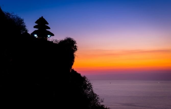 Uluwatu cliff temple panoramic sunset view over Indian Ocean Bali